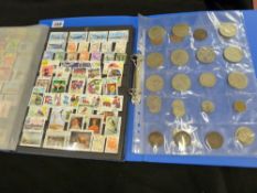 Stamp album with mixed contents and an album of assorted collector's coins
