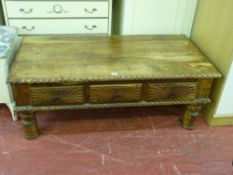 Rustic and carved coffee table with central drawers