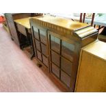 Polished two door bookcase with shaped sides