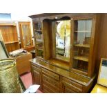 Polished carved front dresser with upper centre bevelled glass mirror section