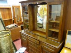 Polished carved front dresser with upper centre bevelled glass mirror section