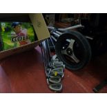 Quantity of Titleist golfing irons, a Trimaster three wheel golf trolley and a quantity of golfing