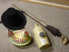Earthenware hot water bottle, hen on nest, snake skin effect umbrella and a Welsh hat