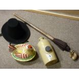 Earthenware hot water bottle, hen on nest, snake skin effect umbrella and a Welsh hat