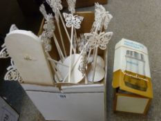 Box containing butterfly patterned menu holders etc