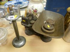Set of early iron scales and weights and a metallic receptacle rack