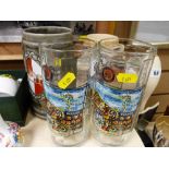 Two large glass steins and two pottery steins