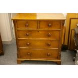 A LATE 19th CENTURY NEAT OAK CHEST of three long and two short drawers with turned wooden knobs