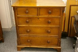 A LATE 19th CENTURY NEAT OAK CHEST of three long and two short drawers with turned wooden knobs