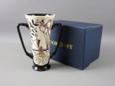 A MOORCROFT 'ROYAL JOY' TWIN HANDLED LOVING CUP, by Nicola Slaney, 15.5 cms high, impressed '