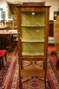 AN EDWARDIAN MAHOGANY & INLAID SINGLE DOOR CHINA DISPLAY CABINET having a shaped back rail to the