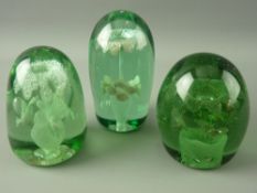 THREE VICTORIAN GREEN GLASS DUMP PAPERWEIGHTS, all having multiple flower head in pot inclusions, 12