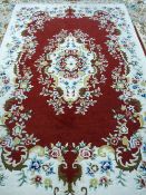 A 20th CENTURY HAND KNOTTED WOOLLEN CARPET, probably Indian