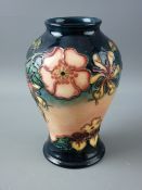 A MOORCROFT OBERON BALUSTER VASE, designed by Rachel Bishop, decorated on a blue and tonal pink
