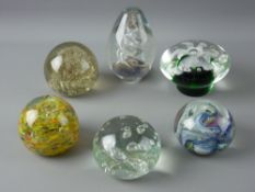 A SELECTION OF SIX VINTAGE GLASS PAPERWEIGHTS with bubble, floral and twist inclusions, various