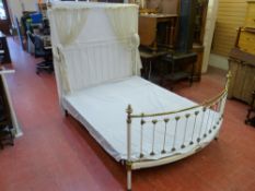 AN R W WINFIELD & CO VICTORIAN BRASS & IRON BED, the raised section with curtain rail, the bowed