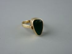 A NINE CARAT GOLD DRESS RING with diamond shaped green agate stone, 17 x 10 mm widest, size 'V', 7.6