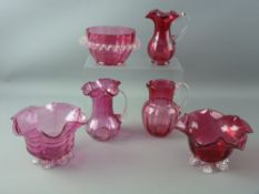 THREE VICTORIAN CRANBERRY GLASS JUG & BOWL SETS, various measurements (chip to one bowl, nibbles