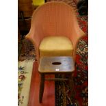 A LLOYD LOOM STYLE PAINTED ARMCHAIR and a vintage oak stool, 71 cms wide the armchair