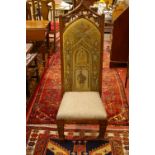 AN OAK GOTHIC STYLE HALL CHAIR with pierced and carved top rail, the tapestry back with knight in