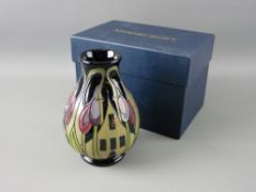A MOORCROFT 'HAMLET' VASE decorated on a black ground, 13.5 cms high, designed by Ceri Goodwin,