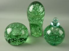 THREE VICTORIAN GREEN GLASS DUMP PAPERWEIGHTS all with bubble inclusions, one inkwell type with