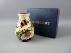 A MOORCROFT 'FLIGHT OF THE BUMBLE BEE' VASE, designed by Rachel Bishop, on a cream and black ground,