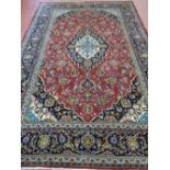 A VINTAGE IRANIAN CARPET, 100% wool pile from the Province of Azerbaijan, 327 x 119 cms, red and