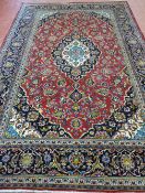 A VINTAGE IRANIAN CARPET, 100% wool pile from the Province of Azerbaijan, 327 x 119 cms, red and