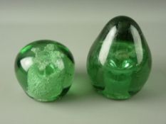 TWO LARGE VICTORIAN GREEN GLASS DUMP PAPERWEIGHTS having flower pot and floriate inclusions, 13