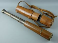 A TWIN PULL LEATHER & BRASS INFANTRY FIELD TELESCOPE in an all leather case, un-named