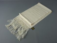 A BIBA CREAM SILK SCARF, 145 x 20 cms with long tasselled ends (two small stains near one end)