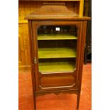 AN EDWARDIAN INLAID MAHOGANY SINGLE DOOR MUSIC CABINET having a shaped rail back and boxwood