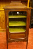 AN EDWARDIAN INLAID MAHOGANY SINGLE DOOR MUSIC CABINET having a shaped rail back and boxwood