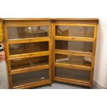 A GOOD PAIR OF POLISHED GLOBE WERNICKE STYLE FOUR SECTION BOOKCASES, each with a narrow top rail and