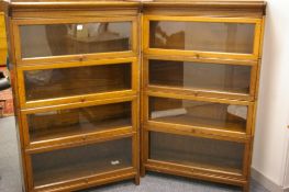 A GOOD PAIR OF POLISHED GLOBE WERNICKE STYLE FOUR SECTION BOOKCASES, each with a narrow top rail and