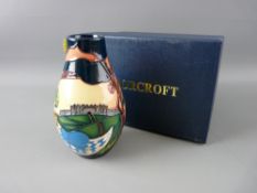 A MOORCROFT 'ANNA LILY' VASE, 8.25 cms high, designed by Nicola Slaney, decorated on a cream and