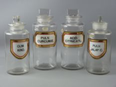 FOUR LARGE CHEMIST'S PLAIN GLASS JARS with well preserved Latin labels and all with stoppers