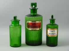 A CHEMIST'S MEDIUM SIZE GREEN GLASS BOTTLE with Latin label, a smaller similar with Latin label