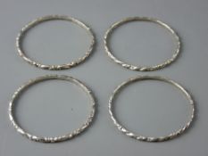 FOUR SILVER SCROLL PATTERN NEPALESE BANGLES, 45 grms