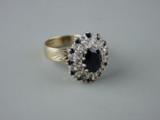 AN EIGHTEEN CARAT WHITE GOLD BLUE & WHITE SAPPHIRE DRESS RING, oval set with centre 10 x 6 mm