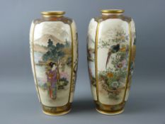 A GOOD PAIR OF EARLY 20th CENTURY SATSUMA BALUSTER VASES, each having two panels of figures in a