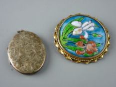 A BRIGHT CUT OVAL LOCKET and a circular Limoges brooch, the locket stamped twenty two carat on