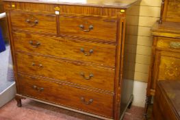 A 19th CENTURY MAHOGANY CHEST of two short over three long drawers with Sheraton shell inlays and
