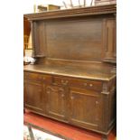 A LARGE VICTORIAN PANEL BACK OAK SIDEBOARD with upper pillar decoration, the base section with two
