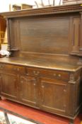 A LARGE VICTORIAN PANEL BACK OAK SIDEBOARD with upper pillar decoration, the base section with two