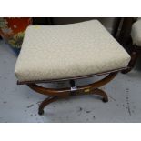 An antique mahogany X-frame footstool (upholstered to match lot 106)