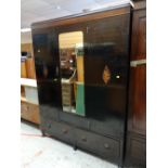 A vintage polished wardrobe with centre mirror & two base drawers