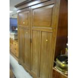 A vintage mahogany double wardrobe with internal drawers