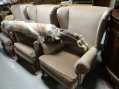 Three matching mushroom coloured Parker Knoll wingback armchairs